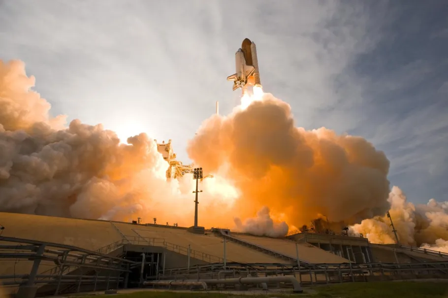 Billows of smoke and steam infused with the fiery light from space shuttle Endeavour's launch on the STS-127 mission fill NASA Kennedy Space Center's Launch Pad 39A. Endeavour lifted off on the mission's sixth launch attempt, on July 15, 2009 at 6:03 p.m. EDT.